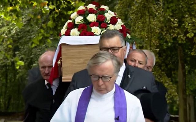 Mourners carry a casket holding the remains of Frank Le Villio during a reburial ceremony at a church in St. Helier, Jersey, on September 5, 2018. (Screen capture: YouTube)