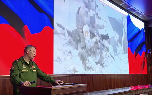 Russian defense ministry spokesman  Maj. Gen. Igor Konashenkov gives a briefing on the downing of a Russian Il-20 military plane near Syria, on September 23, 2018. (Screen capture: Russia Today)
