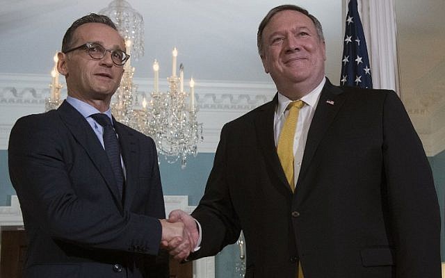 US Secretary of State Mike Pompeo (R) shakes hands with German Foreign Minister Heiko Maas at the State Department in Washington, DC, on October 3, 2018. (AFP Photo/Jim Watson)