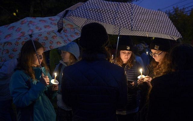 Members of the Squirrel Hill community come together for a student-organized candle vigil in rememberance of those who died earlier in the day during a shooting at the Tree of Life Synagogue in the Squirrel Hill neighborhood of Pittsburgh on October 27, 2018. (Dustin Franz / AFP)
