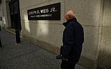 A man walks by the Joseph F. Weis Jr. US Courthouse, where Robert Bowers, the man accused of killing 11 worshipers in a Pittsburgh synagogue on October 27 appeared in federal court on October 29, 2018. (Brendan Smialowski / AFP)