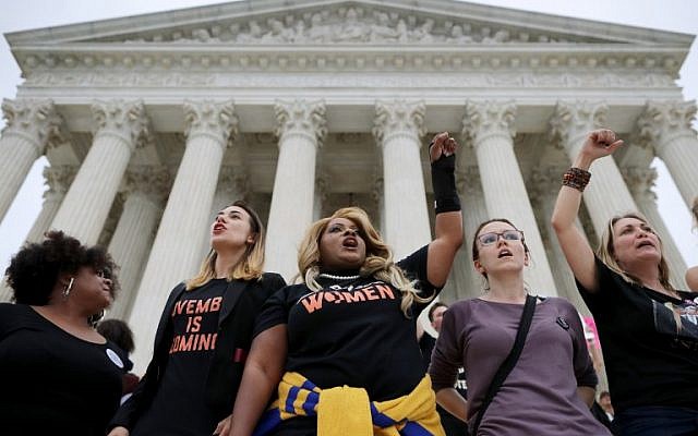 Protesters gather on the steps of the US Supreme Court after over running police barricades while demonstrating the confirmation of Associate Justice Brett Kavanaugh October 6, 2018 in Washington, DC. (Chip Somodevilla/Getty Images/AFP)