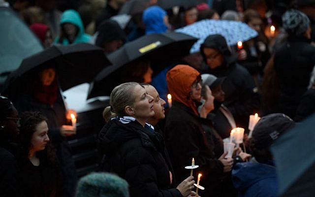 People gather for a interfaith candlelight vigil a few blocks away from the site of a mass shooting at the Tree of Life Synagogue on October 27, 2018 in Pittsburgh, Pennsylvania.    (Jeff Swensen/Getty Images/AFP)