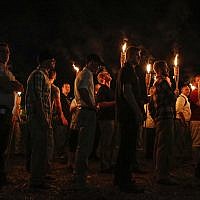 Illustrative: In this photo from August 11, 2017, multiple white nationalist groups march with torches through the University of Virginia campus in Charlottesville, Virginia. (Mykal McEldowney/The Indianapolis Star via AP)