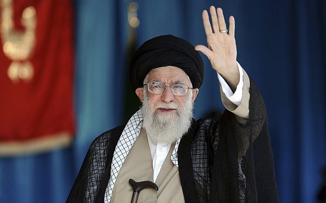 Supreme Leader Ayatollah Ali Khamenei waves to thousands of members of the Basij paramilitary organization in their gathering at the Azadi stadium in Tehran, Iran, on October 4, 2018. (Office of the Iranian Supreme Leader via AP)