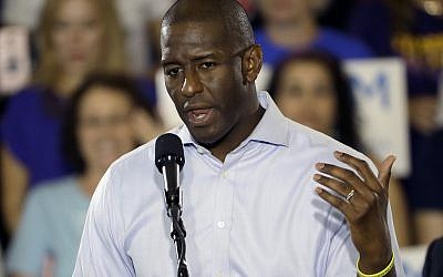 Florida Democratic gubernatorial candidate Andrew Gillum gestures during a campaign rally along with US Sen. Bill Nelson, D-Fla., Monday, Oct. 22, 2018, at the University of South Florida in Tampa, Fla. (AP Photo/Chris O'Meara)