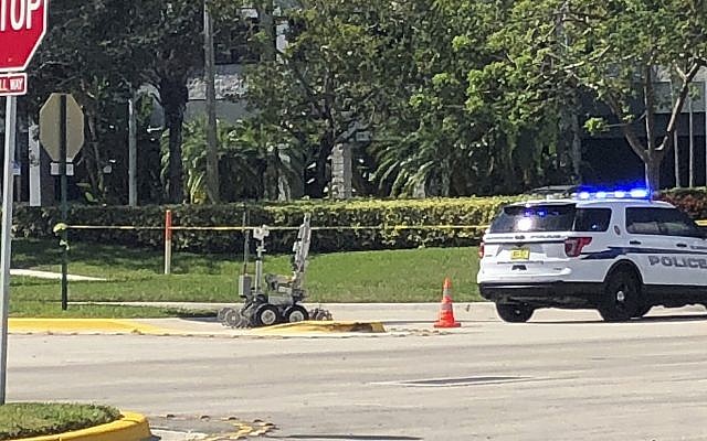 Broward County Sheriffs Office bomb device works outside the office of Rep. Debbie Wasserman Schultz, D-Fla., Wednesday, Oct. 24, 2018 in Sunrise, Fla. The FBI confirms a ‘suspicious package’ went to Schultz’s office in Sunrise, Fla. (AP Photo/Joshua Replogle)