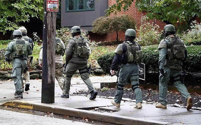 A SWAT team arrives at the Tree of Life Synagogue in Pittsburgh, Pennsylvania, where a shooter opened fire killing and injuring multiple people, Saturday, October 27, 2018. (AP/Gene J. Puskar)