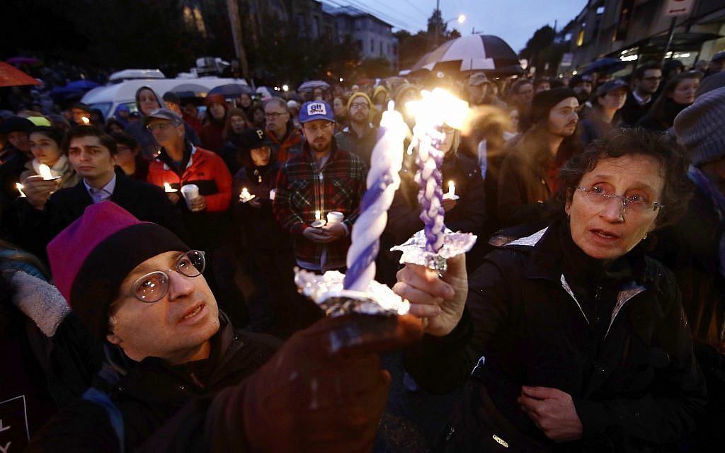 People light candles as they gather for a vigil in the aftermath of a deadly shooting at the Tree of Life Congregation, in the Squirrel Hill neighborhood of Pittsburgh, Saturday, October 27, 2018. (AP/Matt Rourke)