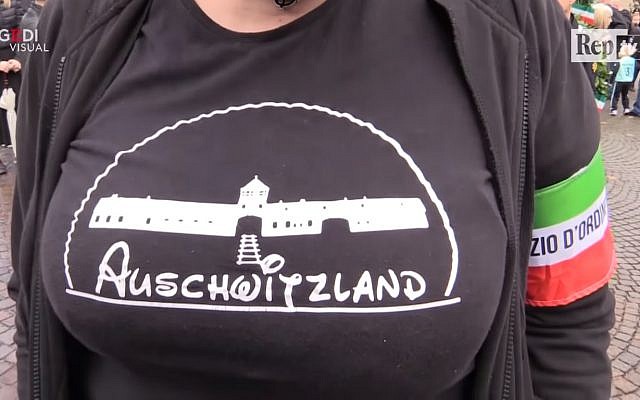 Screen capture from video Selene Ticchi, an activist with the Italian neo-fascist Forza Nuova movement, wears a t-shirt with the slogan 'Asuchwitzland' on it at a rally in the northeast town of Predappio, October 28, 2018. (YouTube)