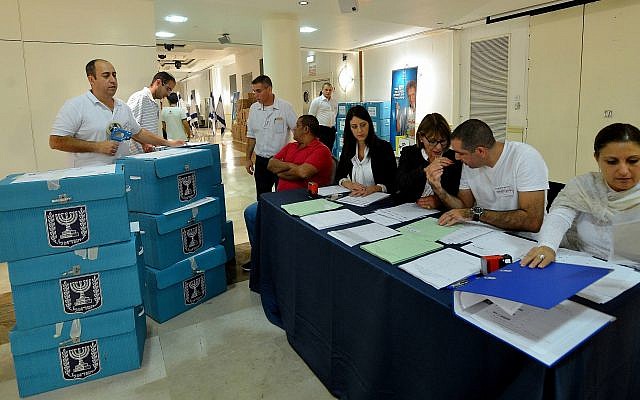 Ballot boxes filled with votes from nationwide municipal elections are brought to the Central Election Committee headquarters for counting, October 22, 2013. (Yossi Zeliger/Flash90)