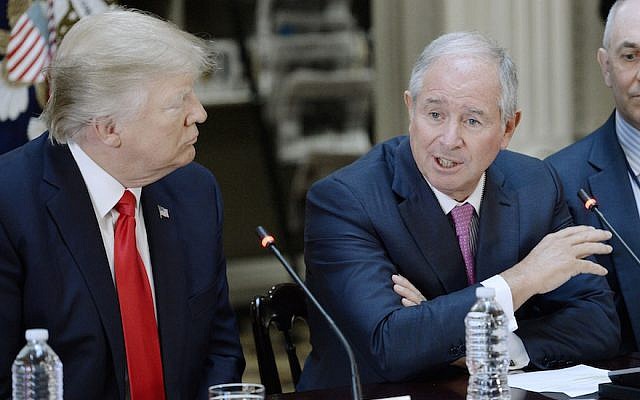 Blackstone CEO Stephen Schwarzman (R) speaks as US President Donald Trump looks on during a strategic and policy discussion with business executives at the State Department Library in the Eisenhower Executive Office Building in Washington, DC, April 11, 2017. (Olivier Douliery/Pool/Getty Images)