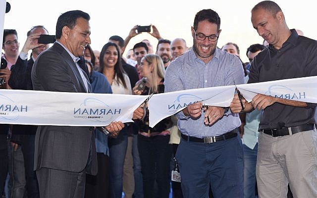 Oren Betzaleli, Country Manager - HARMAN Israel, right; Yuval Weisglass, Vice President Automotive Cybersecurity - HARMAN, center. and  HARMAN President and CEO, Dinesh C. Paliwal at the opening if the firm's new headquarters in Hod Hasharon (Oren Tesler)