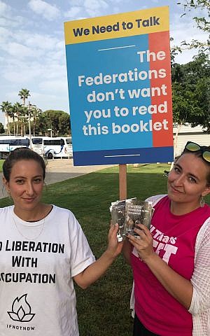 All That’s Left activists with literature at the Jewish Federations of North America General Assembly, Wednesday, October 24, 2018. (Steven Davidson/ Times of Israel)