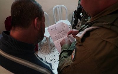 Illustrative. Israeli forces issue a demolition order for the West Bank home of Ashraf Na’alowa, the suspected terrorist who shot and killed two Israelis at the Barkan Industrial Park, October 15, 2018 (IDF Spokesperson's Unit)