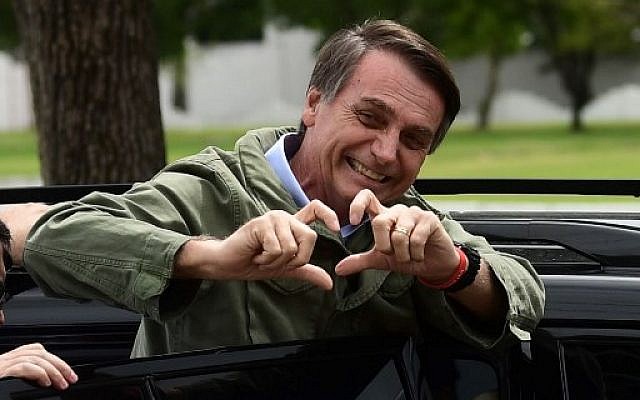 Jair Bolsonaro gestures to supporters during the second round of the presidential elections, in Rio de Janeiro, Brazil, on October 28, 2018. (Mauro Pimentel/AFP)