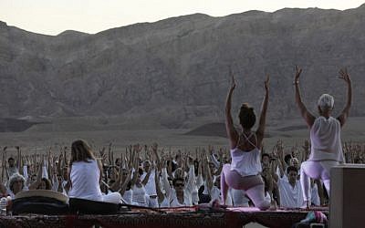 Yogis, Israeli and foreigners, participate in the Arava Yoga annual festival at the ancient copper mines area of the Timna Valley, in the southern Arava region of Israel, north of Eilat on November 2, 2018. (MENAHEM KAHANA / AFP)