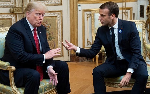 US President Donald Trump (L) speaks with French President Emmanuel Macron prior to their meeting at the Elysee Palace in Paris, on November 10, 2018, on the sidelines of commemorations marking the 100th anniversary of the 11 November 1918 armistice ending World War I. (Photo by SAUL LOEB / AFP)