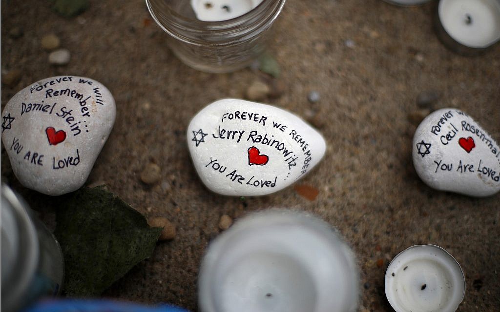 These are stones found on Wednesday, Oct. 31, 2018, part of a makeshift memorial outside the Tree of Life Synagogue to the 11 people killed during worship services Saturday Oct. 27, 2018 in Pittsburgh. (AP Photo/Gene J. Puskar)
