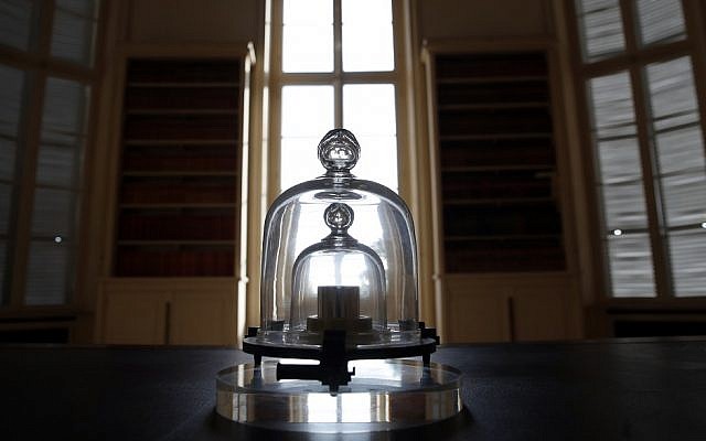 In this photo taken Wednesday, Oct. 17, 2018., a replica of the International Prototype Kilogram is pictured at the International Bureau of Weights and Measures, in Sevres, near Paris (AP Photo/Christophe Ena)