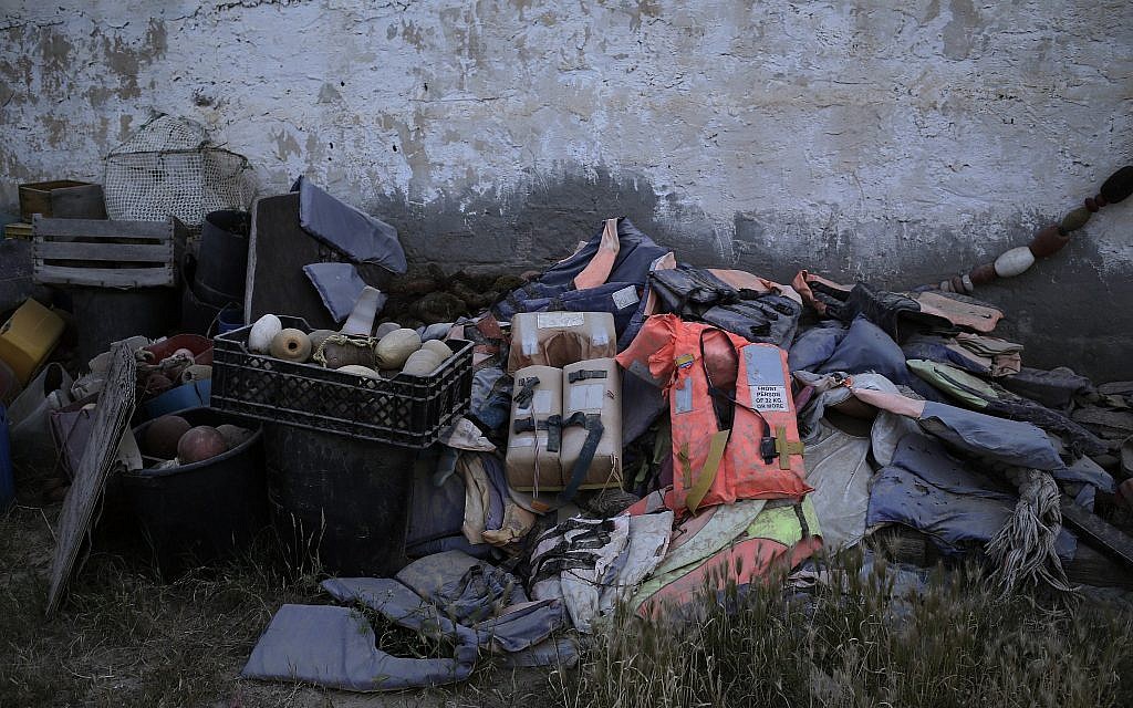 This April 15, 2018 photo shows the belongings of migrants which were collected by artist Mohsen Lahzib, who tries to create beauty out of sorrow, at his space in the southern port town of Zarzis, Tunisia. (AP Photo/Nariman El-Mofty)