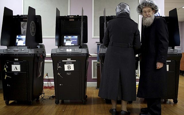 An elderly Orthodox Jewish couple cast their votes at a local polling center on Tuesday, Nov. 6, 2018, in Brooklyn borough of New York. (AP Photo/Wong Maye-E)