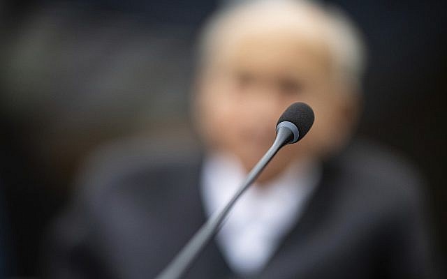 Johann Rehbogen, a 94-year-old former SS enlisted man, who is accused of hundreds of counts of accessory to murder for alleged crimes committed while he served as a guard at the Nazis’ Stutthof concentration camp, waits for the beginning of the third day of his trial at the regional court in Muenster, Germany, November 13, 2018. (Guido Kirchner/pool photo via AP)