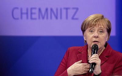 German Chancellor Angela Merkel attends a discussion with citizen at the East German city Chemnitz, Friday, Nov. 16, 2018. (AP Photo/Kay Nietfeld, Pool)