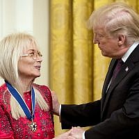 President Donald Trump awards Miriam Adelson, the wife of Las Vegas Sands Corporation Chief Executive Sheldon Adelson and Republican mega donor the Medal of Freedom during a ceremony in the East Room of the White House in Washington, Friday, Nov. 16, 2018. (AP Photo/Andrew Harnik)