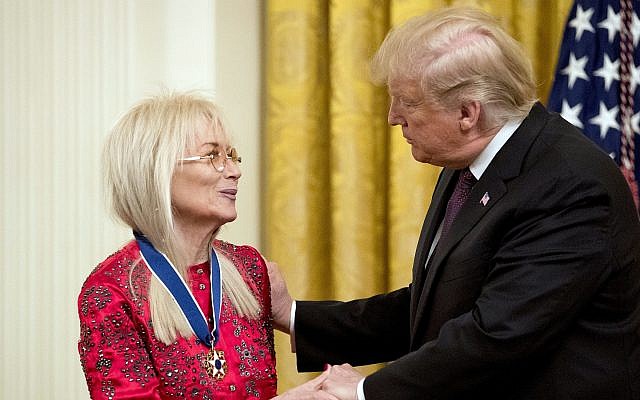 President Donald Trump awards Miriam Adelson, the wife of Las Vegas Sands Corporation Chief Executive Sheldon Adelson and Republican mega donor the Medal of Freedom during a ceremony in the East Room of the White House in Washington, Friday, Nov. 16, 2018. (AP Photo/Andrew Harnik)