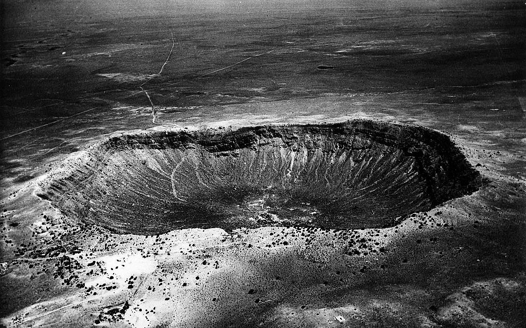 Disaster shown in an undated photo of the mile-wide meteor crater near Winslow, Arizona. The crater was made 500 centuries ago when a 10,000,000-ton meteor impact dislodged 300,000,000 tons of rock. The 600 foot deep crater is three miles in circumference. (AP photo/ho)