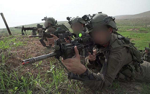 Soldiers from the IDF Commando Brigade simulate fighting the Hezbollah terror group,  in northern Israel, in November 2018. (Israel Defense Forces)
