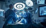 Illustrative: A medical team performs surgery in a modern operating room. (gorodenkoff; iStock by Getty Images)