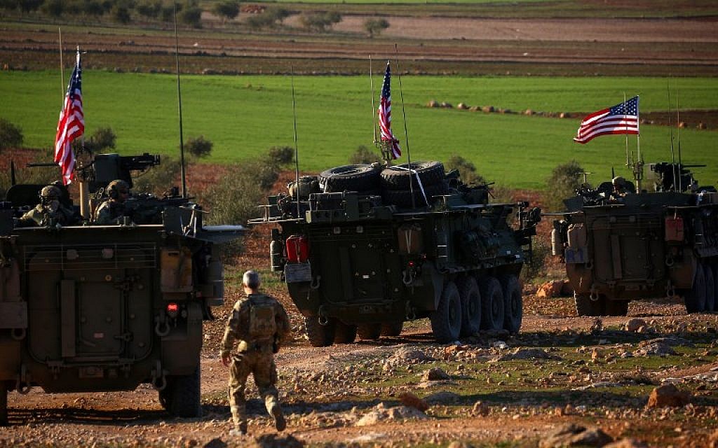 US forces armored vehicles drive near the village of Yalanli, on the western outskirts of the northern Syrian city of Manbij, on March 5, 2017. (Delil Souleiman/AFP)