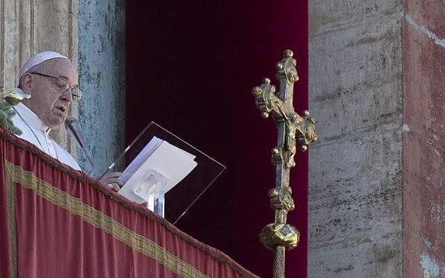Pope Francis delivers a speech from the balcony of St. Peter's basilica during the traditional "Urbi et Orbi" Christmas message to the city and the world, on December 25, 2018 at St. Peter's square in Vatican. (Photo by Tiziana FABI / AFP)