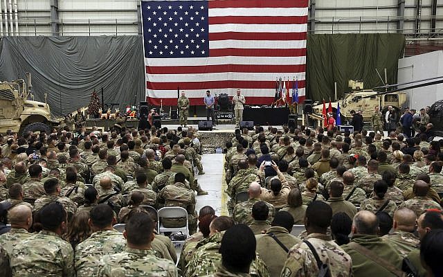 Gen. Joseph Dunford, chairman of the US Joint Chiefs of Staff speaks during a ceremony on Christmas Eve at a US airfield in Bagram, north of Kabul, Afghanistan, December 24, 2017. (AP/Rahmat Gul)