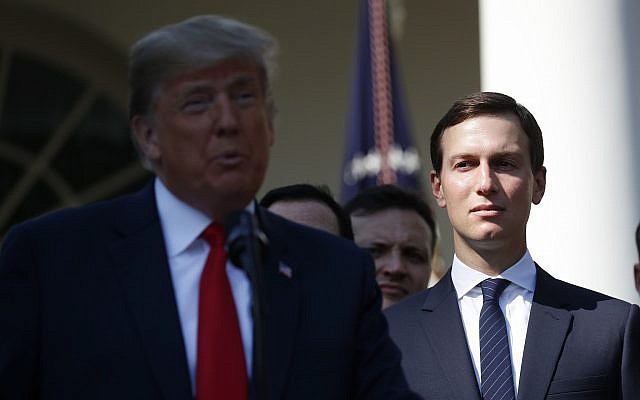White House Senior Adviser Jared Kushner, right, listens as US President Donald Trump, left, announces a revamped North American free trade deal, in the Rose Garden of the White House on October 1, 2018. (AP Photo/Pablo Martinez Monsivais)