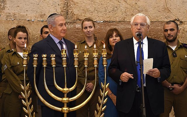 U.S. Ambassador to Israel David M. Friedman and his wife Tammy joined Prime Minister Benjamin Netanyahu at Jerusalem’s Western Wall for a candle-lighting ceremony marking the fifth night of Hanukkah to mark one year since President Trump’s December 6, 2017 declaration on moving the U.S. Embassy to Jerusalem. (Matty Stern/U.S. Embassy Jerusalem)