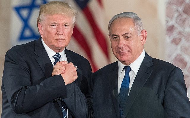 US President Donald Trump, left, and Prime Minister Benjamin Netanyahu shake hands at the Israel Museum in Jerusalem on May 23, 2017. (Yonatan Sindel/Flash90)