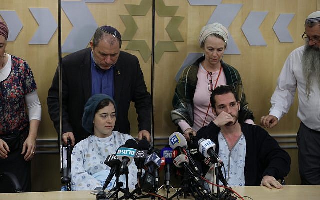 Shira and Amichai Ish-Ran, both injured on December 9, 2018 when a Palestinian terrorist opened fire on Israelis near the settlement of Ofra, hold a press conference at the Shaare Zedek hospital in Jerusalem on December 16, 2018. (Yonatan Sindel/FLASH90)