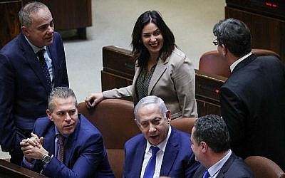 From left to right: Energy Minister Yuval Steinitz, Public Security Minister Gilad Erdan, Culture Minister Miri Regev (standing), Prime Minister Benjamin Netanyahu, then-transportation minister Israel Katz and Science and Technology Minister Ofir Akunis during a Knesset vote on a bill to dissolve parliament, at the Knesset in Jerusalem on December 26, 2018. (Yonatan Sindel/Flash90)