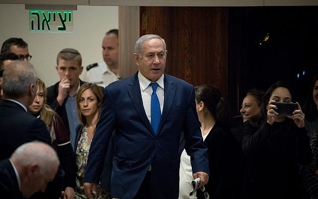 Prime Minister Benjamin Netanyahu arrives at a Plenary Hall session for a vote on a bill to dissolve parliament, at the Knesset in Jerusalem on December 26, 2018 (Yonatan Sindel/Flash90)