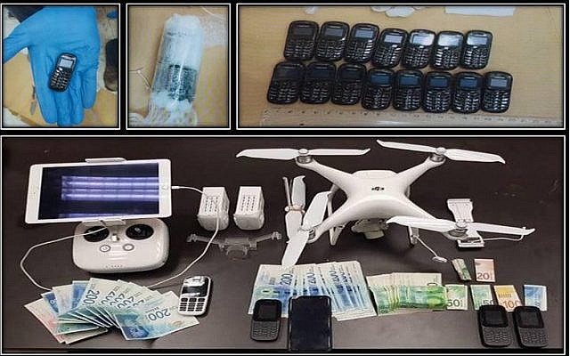 A picture released by the Shin Bet security agency on December 6, 2018, shows cellphones, a drone and cash that were allegedly tied to a failed attempt to smuggle phones into a security prison using a drone. (Shin Bet)