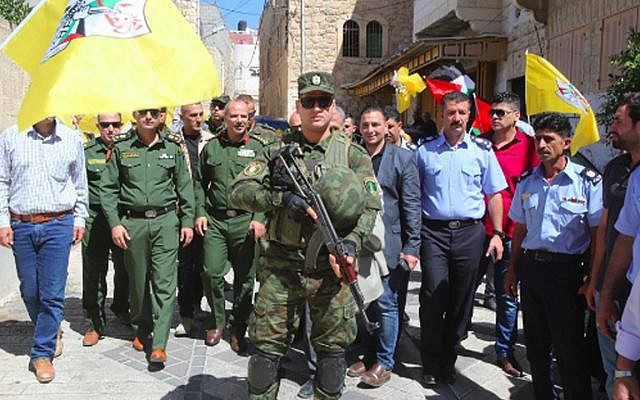 Palestinian Authority security forces touring Israeli-controlled Hebron in uniform. (Wafa)