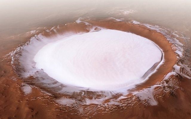 This image from ESA’s Mars Express shows Korolev crater, an 82-kilometre-across feature found in the northern lowlands of Mars. This oblique perspective view was generated using a digital terrain model and Mars Express data (ESA/DLR/FU Berlin, CC BY-SA 3.0 IGO)