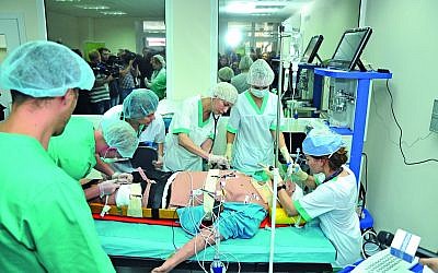 Students work on a specially crafted treatment mannequin at the $5 million medical simulation center that the European Union paid for at Nicolae Testemitanu Medical University. (Andrei Ichim/ Nicolae Testemitanu Medical University)