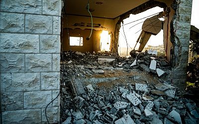 The Israeli military on December 17, 2018, partially destroys the home of Ashraf Na'alowa, a Palestinian terrorist who killed two Israelis and injured a third in a shooting attack in the Barkan industrial zone two months prior. (Israel Defense Forces)