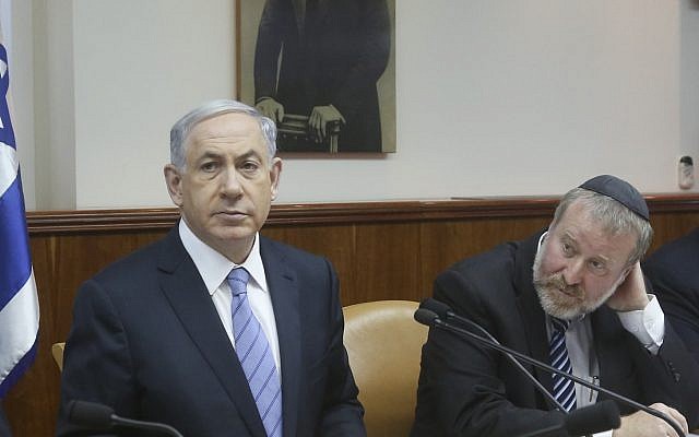 Prime Minister Benjamin Netanyahu, left, and then-cabinet secretary Avichai Mandelblit, at a cabinet meeting on January 4, 2015. (Marc Israel Sellem/Pool/Flash90/File)