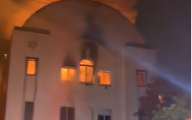 A fire burns in Beit Midrash Morasha, also known as Arthur’s Road Shul in Cape Town, South Africa on December 4, 2018 (Screenshot/YouTube)
