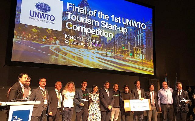 The winners and WTO, Globalia, and Refundit representatives on stage in Madrid on January 23, 2019 (Refundit)